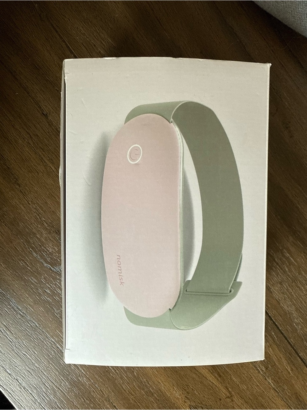 Nomisk wearable heating and massaging band
